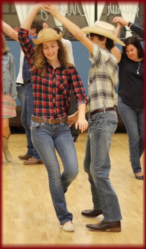 A young couple learning how to Country Dance in Dance Class - Dance Lessons